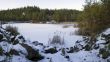 Panorama of an abandoned stone pit in winter 