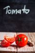 fresh tomatoes and blackboard 