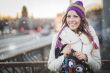 Winter woman with colorfull hat in city