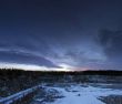 Snow covered stone quarry in the winter with all the tools and b