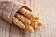 bread sticks grissini with sesame seeds in craft pack 