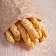 bread sticks grissini with sesame seeds in craft pack 