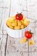 uncooked pasta and cherry tomatoes in a bowl 