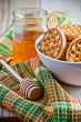 fresh cookies in a bowl, tablecloth and honey 