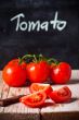 fresh tomatoes, knife and blackboard 