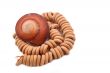 Shell with wood beads on the white background