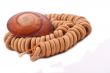 Shell with wood beads on the white background