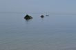Fisherman between rocks