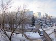 A view from the window on the winter city and houses  by fisheye view