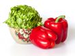 Two large red paprikas and bunch of fresh salad