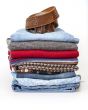 Pile of woolen jumpers of various colors and textures