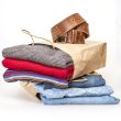 Shopping: jumper and jeans in paper packages