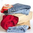 Shopping: jumper and jeans in paper packages