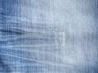 Texture of threadbare denim of indigo color