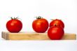 Red juicy tomatoes on the table