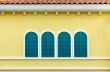 Four green arched windows on yellow wall