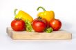Large paprika of yellow color and red tomatoes