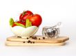 Red juicy tomatoes, lettuce leaves and black pepper