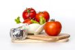Red juicy tomatoes, lettuce leaves and black pepper