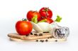 Red juicy tomatoes, lettuce leaves and black pepper
