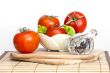 Red juicy tomatoes, lettuce leaves and black pepper