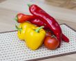 Large paprika of red and yellow color and fresh tomatoes