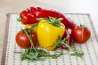 Tomatoes, leaves of arugula and sweet pepper