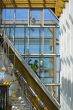 Workers wash a glass wall