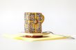 Ceramic coffee cup with a square saucer