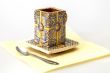 Ceramic coffee cup with a square saucer