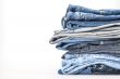 Pile of jeans of various colors