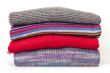 Pile of woolen jumpers of various colors