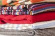 Pile of woolen jumpers of various colors