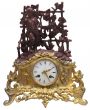 golden table clocks with statuette