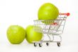 Large green apples in the cart for shopping