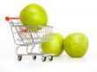 Large green apples in the cart for shopping