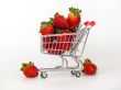 Large ripe strawberry in the cart for shopping