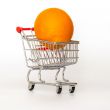 Large bright oranges in the cart for shopping