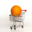 Large bright oranges in the cart for shopping