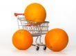 Large bright oranges in the cart for shopping