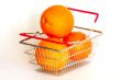 Bright large oranges in a basket for shopping