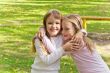 Cute two embracing girls