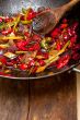 fried chili pepper and vegetable on a wok pan
