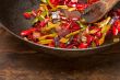 fried chili pepper and vegetable on a wok pan