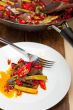 fried chili pepper and vegetable on a wok pan