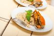 Italian gnocchi with seafood sauce with crab and basil