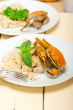 Italian gnocchi with seafood sauce with crab and basil