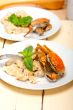 Italian gnocchi with seafood sauce with crab and basil
