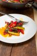 fried chili pepper and vegetable on a wok pan