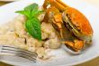 Italian gnocchi with seafood sauce with crab and basil